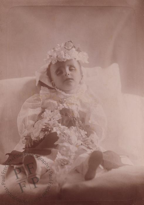 Boy covered with flowers
