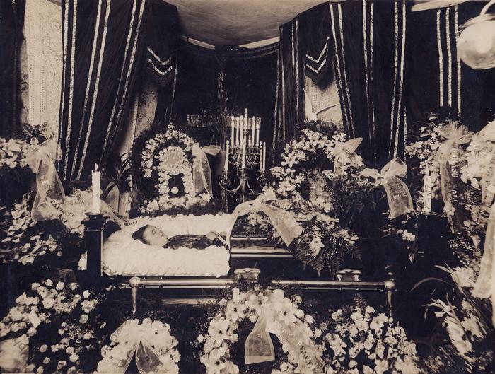 Woman in a half-couch casket