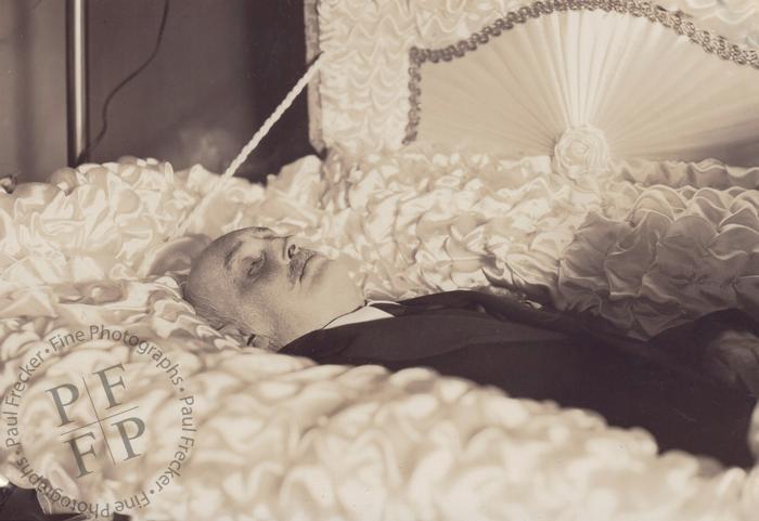 Man in a satin-lined casket