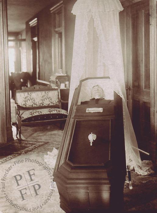 Open casket in a living room