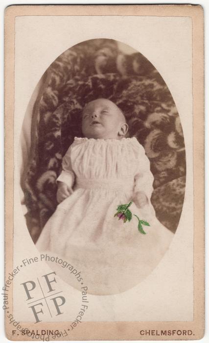 Baby with a painted flower