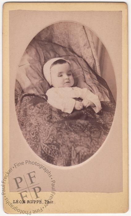 Infant in a baby bonnet