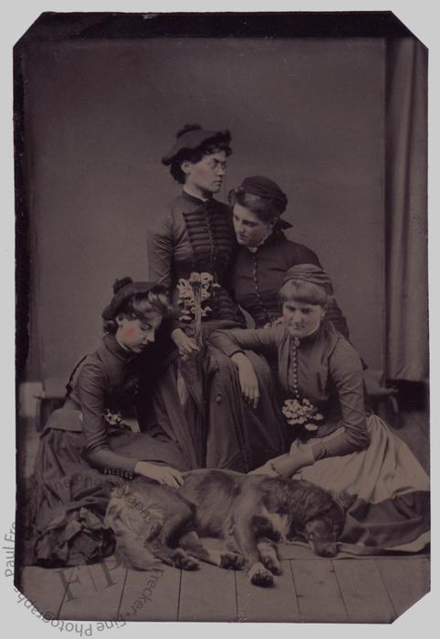 Four young women with a dead dog