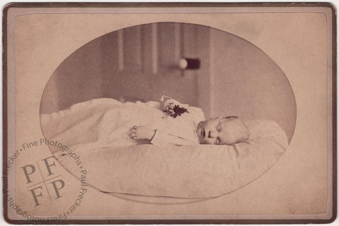 Baby with a posy