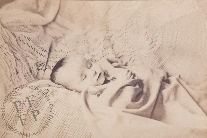 Baby on a crocheted bedspread