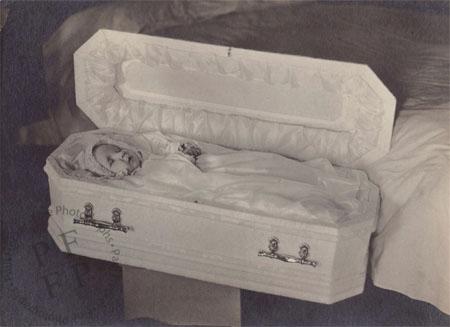 Baby in a white casket