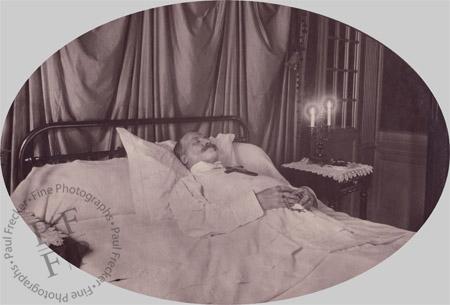 Man on deathbed with candles