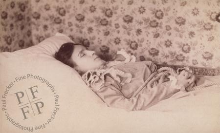 Woman with floral wallpaper