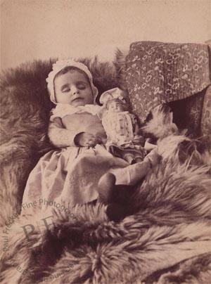 Small girl with a doll