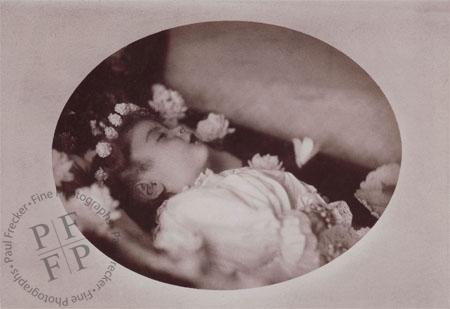 Child with a wreath of flowers