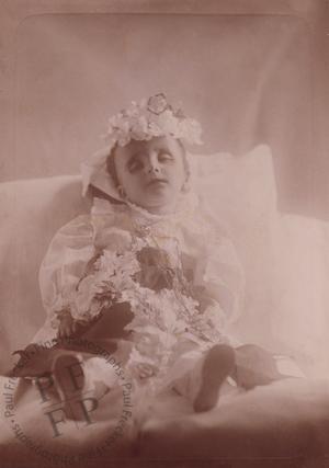 Boy covered with flowers