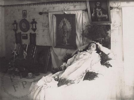 Young girl laid out in a parlour