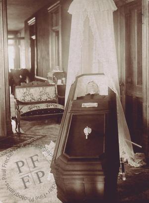 Open casket in a living room